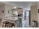 Updated kitchen featuring granite countertops, modern cabinetry, and a sleek stainless steel refrigerator at 2825 74Th W St, Bradenton, FL 34209