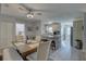 Open-concept kitchen with granite counters, modern appliances, and a dining area at 2825 74Th W St, Bradenton, FL 34209