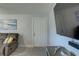 The living room features stylish furnishings, neutral colors, and a wall-mounted television at 2825 74Th W St, Bradenton, FL 34209