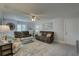 Cozy living room features comfortable sofas, plantation shutters, and beachy décor at 2825 74Th W St, Bradenton, FL 34209