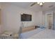 Bright main bedroom boasts ceiling fan, updated decor, and private access to the bathroom at 2825 74Th W St, Bradenton, FL 34209