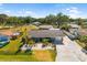 Aerial view of the home showing the landscaped yard, driveway, and surrounding neighborhood at 2929 Siesta Dr, Venice, FL 34293