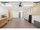 Spacious garage with ample storage, work space, and lighting; utility room visible in back at 2929 Siesta Dr, Venice, FL 34293