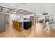 Open layout from the dining area into the kitchen, which features bar seating and stainless steel appliances at 2929 Siesta Dr, Venice, FL 34293