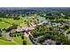 A beautiful community has a large pond and manicured golf course at 340 Osprey Point Dr, Osprey, FL 34229