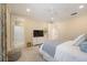 Comfortable bedroom with soft carpet, ceiling fan, and attached bathroom at 340 Osprey Point Dr, Osprey, FL 34229