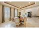 Bright dining room with round wood table and chairs, enhanced by natural light at 340 Osprey Point Dr, Osprey, FL 34229