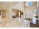 Expansive foyer boasts soaring ceilings, marble floors, and an elegant dining area at 340 Osprey Point Dr, Osprey, FL 34229