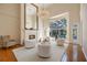 Large living room featuring a fireplace, comfortable seating, and pool view at 340 Osprey Point Dr, Osprey, FL 34229