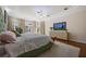 Spacious main bedroom with tray ceiling, large windows, and plush carpet at 340 Osprey Point Dr, Osprey, FL 34229