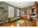 Well appointed office with built in shelves, hardwood floors, and bold wallpaper at 340 Osprey Point Dr, Osprey, FL 34229