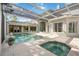 A luxurious screened-in pool and spa offers a private oasis for relaxation and enjoyment at 340 Osprey Point Dr, Osprey, FL 34229