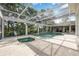An inviting screened-in pool and jacuzzi provides a serene outdoor retreat at 340 Osprey Point Dr, Osprey, FL 34229