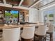 Full bar with a wide selection of spirits and a television broadcasting a golf game at 355 Melrose Ct, Venice, FL 34292