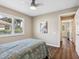 Bedroom with a window, plantation shutters, luxury vinyl flooring, and neutral paint at 355 Melrose Ct, Venice, FL 34292