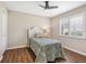 Neutral bedroom with a window, plantation shutters, luxury vinyl flooring, and neutral paint at 355 Melrose Ct, Venice, FL 34292