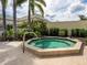 Enjoy a relaxing soak in the community hot tub surrounded by tropical landscaping at 355 Melrose Ct, Venice, FL 34292