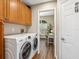 Modern laundry room with built in cabinets next to office nook at 355 Melrose Ct, Venice, FL 34292
