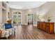 Inviting foyer with natural light, wood floors, and an open view to other rooms at 355 Melrose Ct, Venice, FL 34292