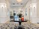 Elegant lobby featuring decorative columns, modern lighting, and a beautiful floral arrangement at 355 Melrose Ct, Venice, FL 34292