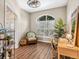 Bright home office featuring a ceiling fan, a window with plantation shutters, luxury vinyl flooring, and neutral paint at 355 Melrose Ct, Venice, FL 34292