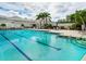 Community swimming pool with plenty of space for swimming laps and lounging at 355 Melrose Ct, Venice, FL 34292