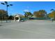 This tennis court features a shelter, lighting, and a well-maintained playing surface for active recreation at 355 Melrose Ct, Venice, FL 34292