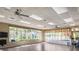 Bright yoga studio with hardwood floors, large windows, and exercise equipment at 355 Melrose Ct, Venice, FL 34292