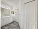 Bathroom features a dual sink vanity, walk-in shower and large mirror at 3706 Shimmering Oaks Dr, Parrish, FL 34219
