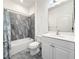 Bathroom featuring tiled shower and bathtub combo, toilet, and vanity with sink at 3706 Shimmering Oaks Dr, Parrish, FL 34219