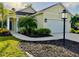 Charming one-story home featuring a well-manicured lawn and beautiful landscaping at 3706 Shimmering Oaks Dr, Parrish, FL 34219