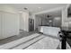 Bright kitchen features white cabinets, stainless steel appliances, tile floors and black countertops at 3706 Shimmering Oaks Dr, Parrish, FL 34219