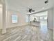 Large, bright living room with tile floors, an open layout, and windows for natural light at 3706 Shimmering Oaks Dr, Parrish, FL 34219