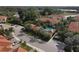 An aerial view of the community, featuring a pool, lush landscaping, and well-maintained grounds at 4236 Expedition Way # 106, Osprey, FL 34229