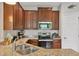 Updated kitchen with granite counters, stainless steel appliances, and ample cabinet space at 4236 Expedition Way # 106, Osprey, FL 34229