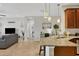 Open concept view of the kitchen, living room, and hall with lots of natural light at 4236 Expedition Way # 106, Osprey, FL 34229