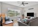 Bright living space featuring two sofas, a tv, decorative accents, and a ceiling fan at 4236 Expedition Way # 106, Osprey, FL 34229