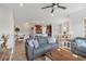 Spacious living room open to kitchen and dining area with tile flooring throughout at 4236 Expedition Way # 106, Osprey, FL 34229