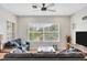Cozy living room with comfortable seating, large windows, and stylish decor at 4236 Expedition Way # 106, Osprey, FL 34229