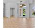 Open foyer with high ceilings, tiled floors, and a view to the front yard through glass double doors at 4713 Sweetmeadow Cir, Sarasota, FL 34238