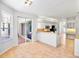 Open kitchen and breakfast nook with granite countertops and access to outdoor lanai at 4713 Sweetmeadow Cir, Sarasota, FL 34238