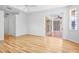 Bright living room with hardwood floors and sliding glass doors leading to the patio at 4713 Sweetmeadow Cir, Sarasota, FL 34238