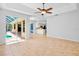 Open living area with easy access to kitchen and screened in outdoor pool at 4713 Sweetmeadow Cir, Sarasota, FL 34238