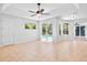 Spacious living room with access to the pool area and abundant natural light at 4713 Sweetmeadow Cir, Sarasota, FL 34238
