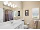 Neutral bathroom with large vanity, shower with curtain, and natural light at 4961 Sabal Lake Cir, Sarasota, FL 34238