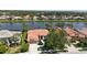 Charming single-story home boasts a new tile roof and is situated on a picturesque lakefront property at 4961 Sabal Lake Cir, Sarasota, FL 34238