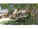 Well-maintained home with lush landscaping and a curved walkway to the front door at 4961 Sabal Lake Cir, Sarasota, FL 34238