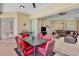 Comfortable outdoor space featuring a dining set and grill, adjacent to the living area at 4961 Sabal Lake Cir, Sarasota, FL 34238