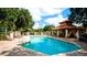 Community pool, clubhouse and comfortable lounge seating available at 4961 Sabal Lake Cir, Sarasota, FL 34238