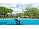 Community tennis court with new equipment and lighting at 4961 Sabal Lake Cir, Sarasota, FL 34238